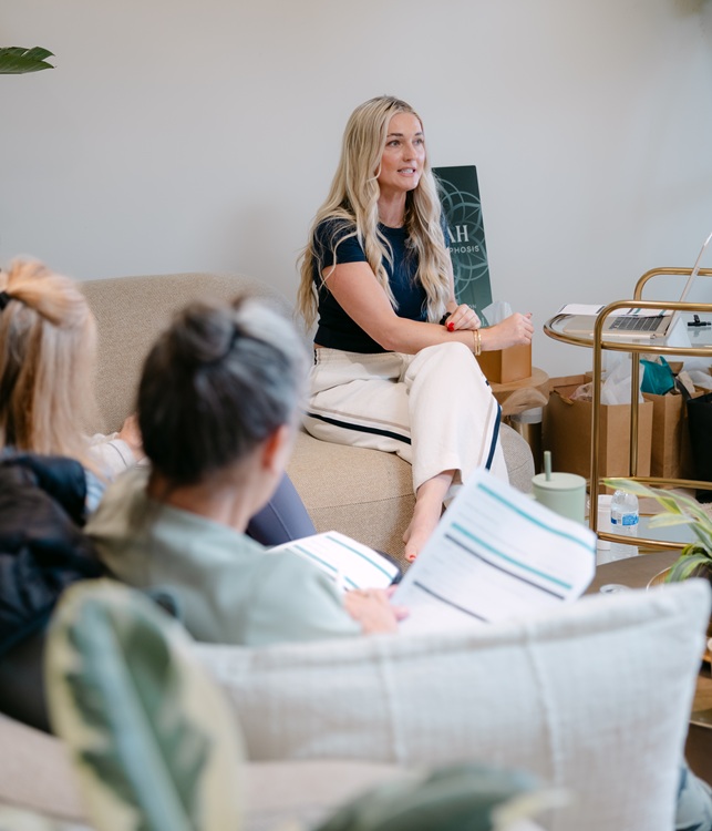 Cheyanne speaking at a wellness retreat